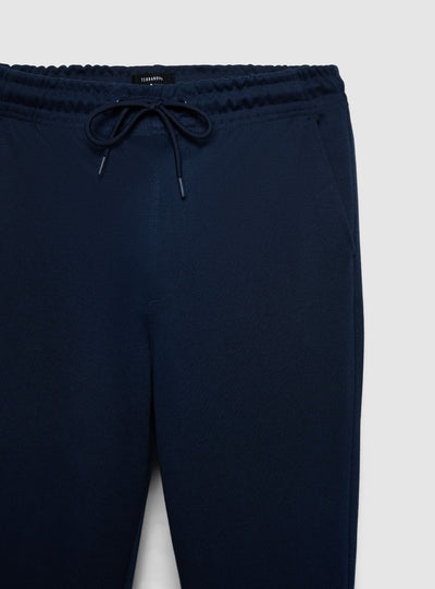 Pantaloni tuta lunghi in piquet con risvolto