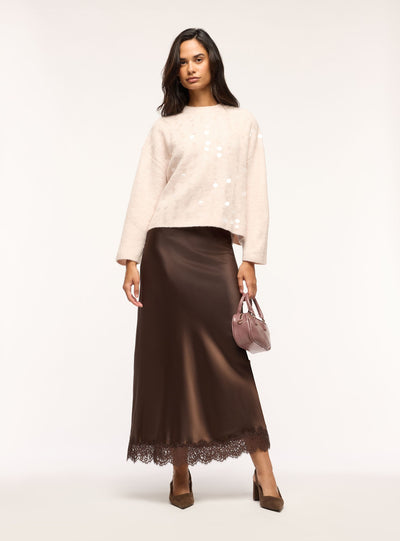 Gonna lunga svasata in satin con bordo in pizzo