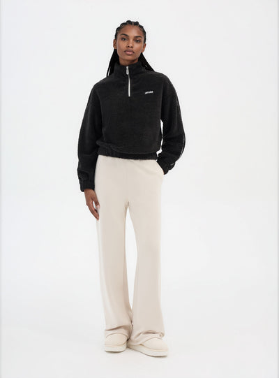 Felpa in sherpa con mezza zip e scritta