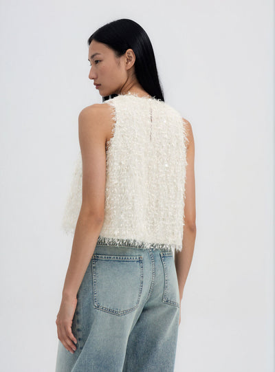Top con paillettes e effetto piumette
