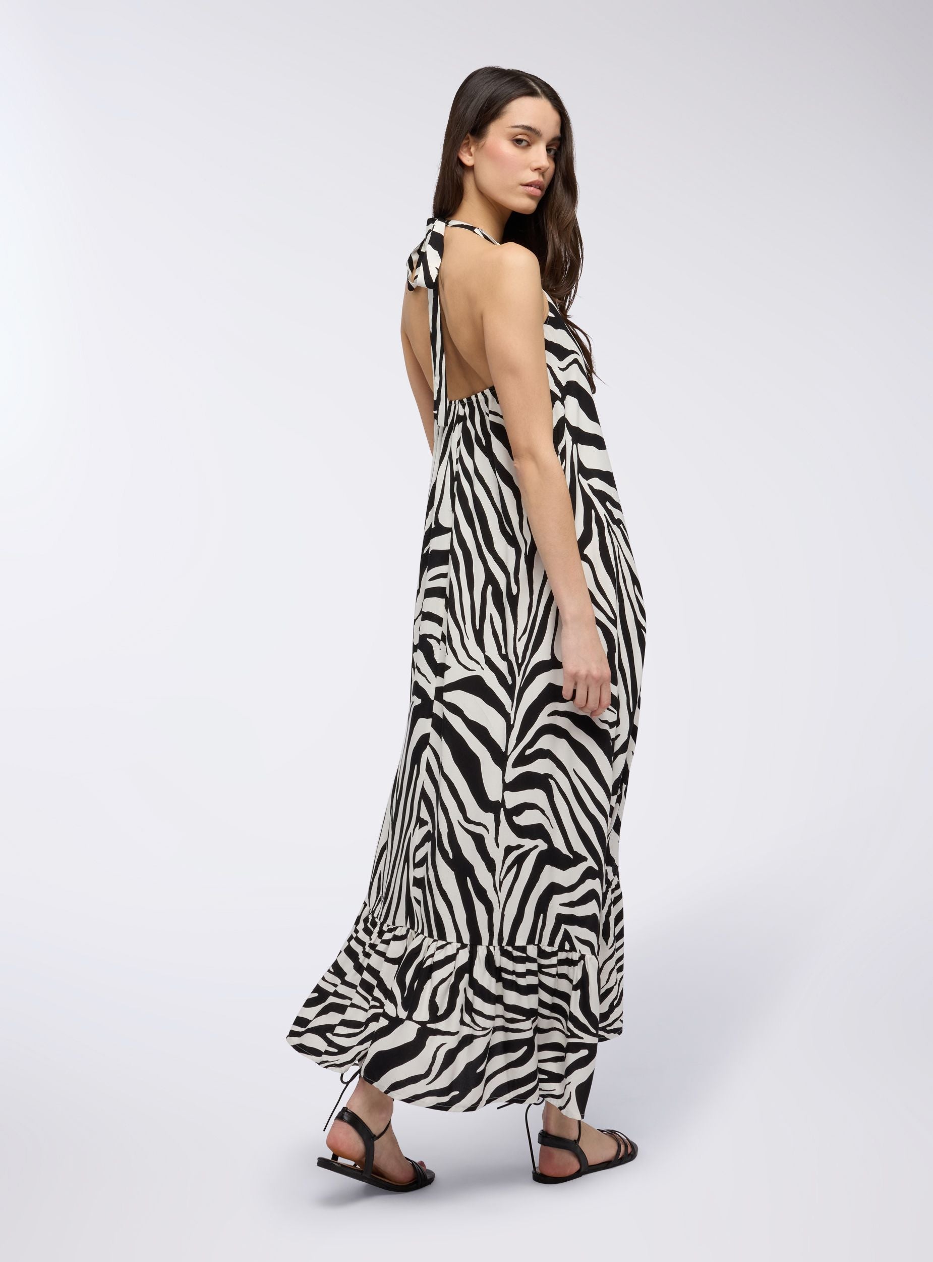 Long zebra-print dress with halter neckline Long zebra-print dress with halter neckline