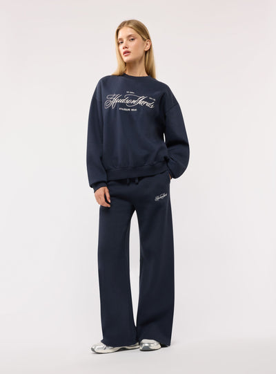 Pantaloni tuta wide leg con ricamo college