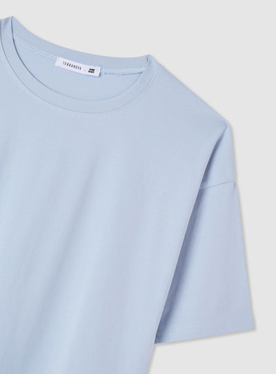 T-shirt con fondo asimmetrico e inserti in pizzo