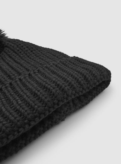 Cappellino beanie con pon pon a tinta unita