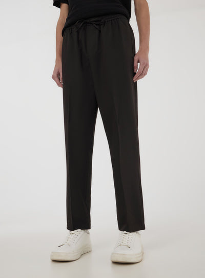 Pantaloni con elastico in vita e coulisse tinta unita