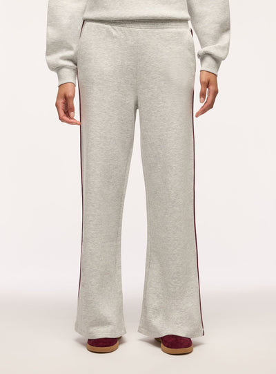 Pantaloni tuta wide leg con piping laterale