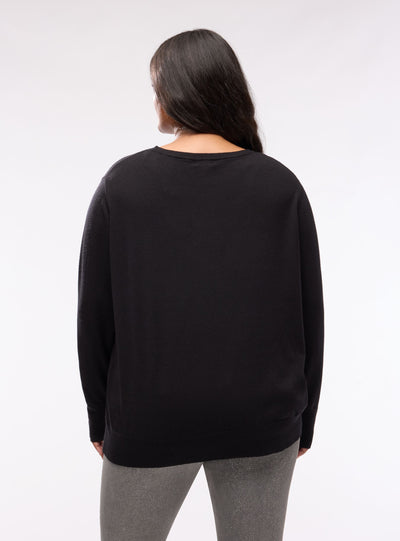 Plain-colour jumper with buttons at the cuffs