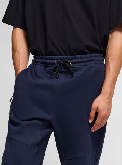 Pantaloni tuta con zip e coulisse