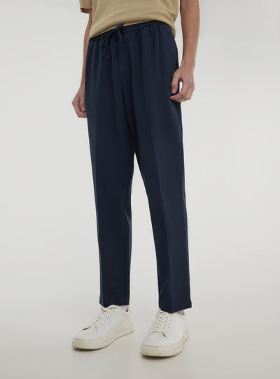 Pantaloni con elastico in vita e coulisse tinta unita