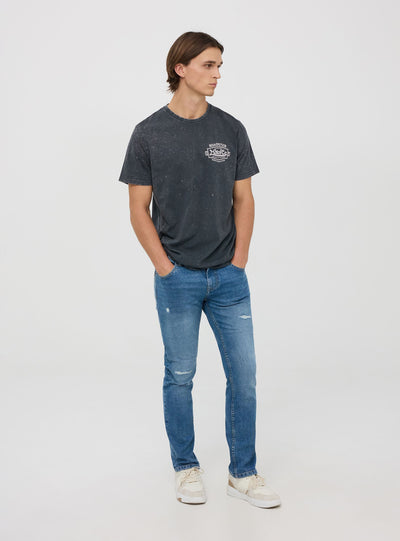 Jeans regular fit con strappi