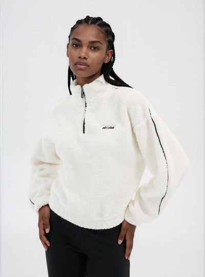 Felpa in sherpa con mezza zip e scritta