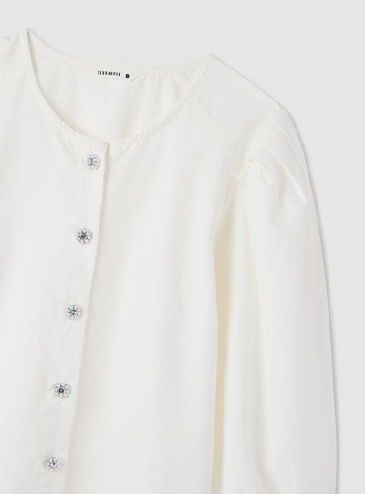 Blusa con bottoni gioiello e maniche a sbuffo