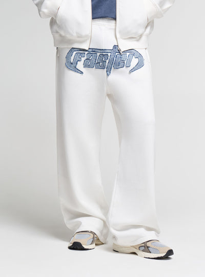 Pantaloni tuta wide leg con patch ricamata