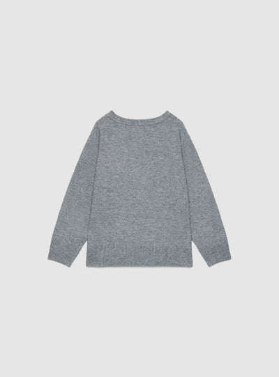 Plain-coloured top with V-neck and side buttons