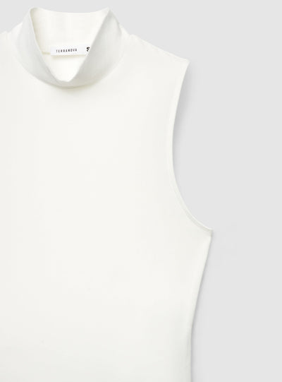 Top crop a tinta unita con collo lupetto