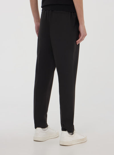 Pantaloni con elastico in vita e coulisse tinta unita