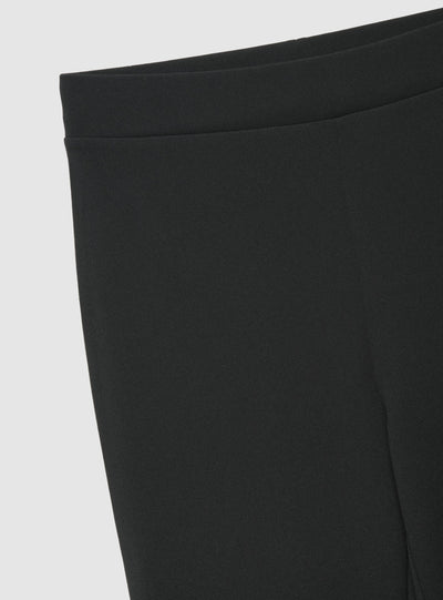 Pantaloni a zampa a tinta unita