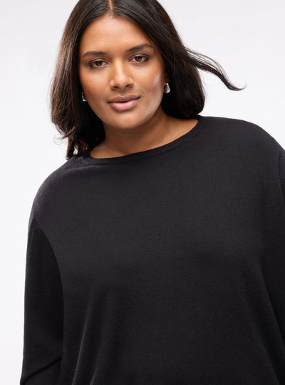 Plain-colour jumper with buttons at the cuffs