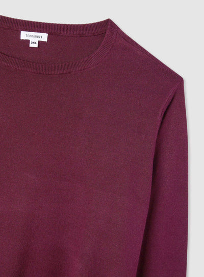 Pull uni avec boutons aux poignets