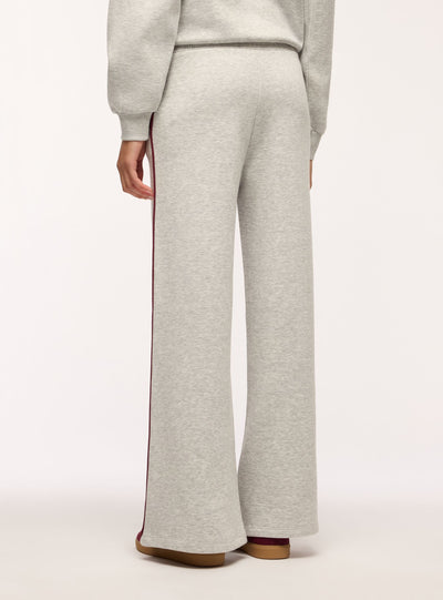 Pantaloni tuta wide leg con piping laterale