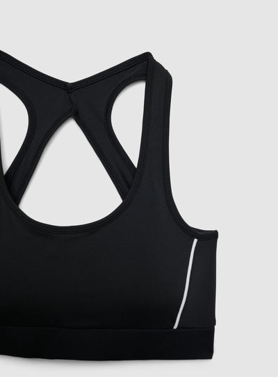 Top sportivo con retro incrociato e piping