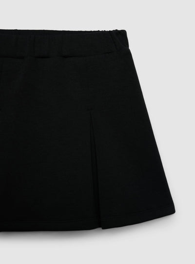 Skort da bambina con pieghe a tinta unita