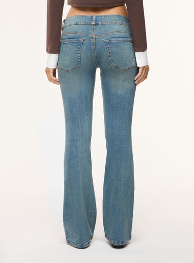 Jeans bootcut a vita bassa tinta unita