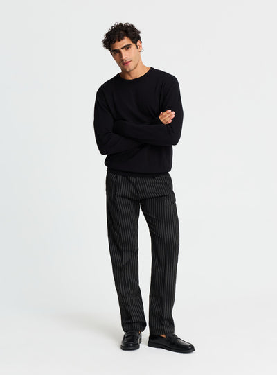 Pantaloni chino con pinces gessati
