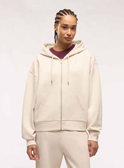 Felpa over con zip e cappuccio a tinta unita