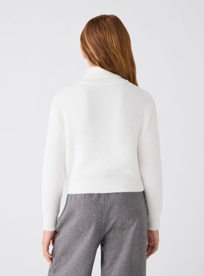 Maglia crop dolcevita a tinta unita