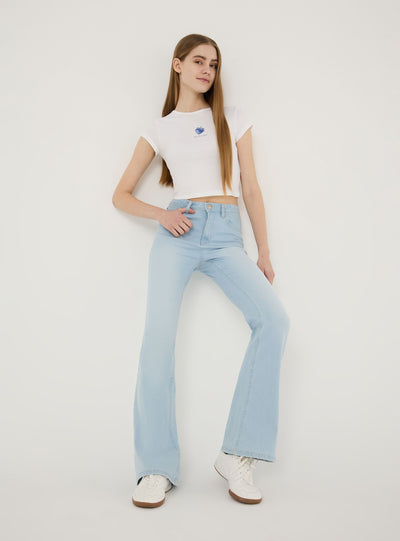 Jeans chiari a zampa a vita alta