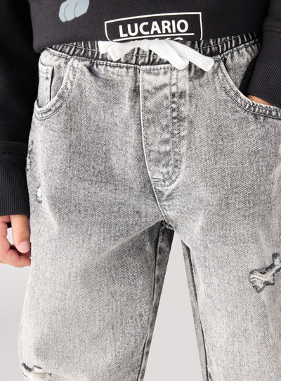 Children's jogger jeans with rips and drawstring