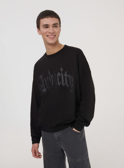 Felpa boxy fit senza cappuccio scritta similpelle