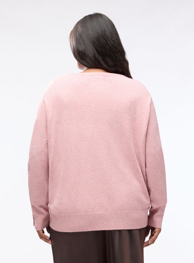 Plain-colour jumper with buttons at the cuffs