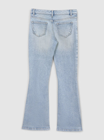 Jeans chiari a zampa con strappi