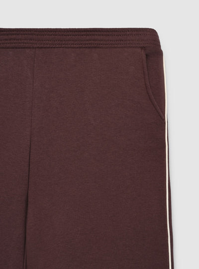 Pantaloni tuta maxi con piping laterale