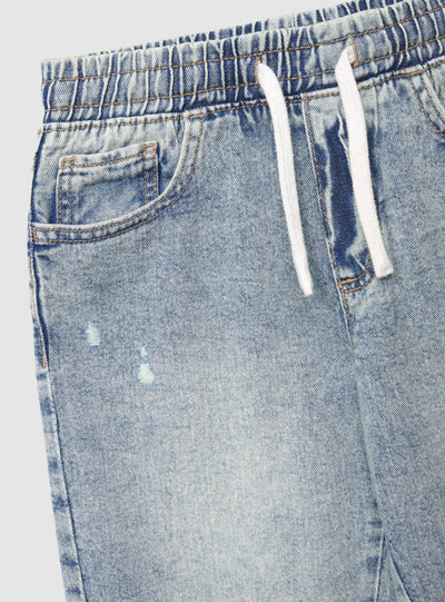 Jeans jogger con strappi e coulisse