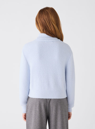 Maglia crop dolcevita a tinta unita