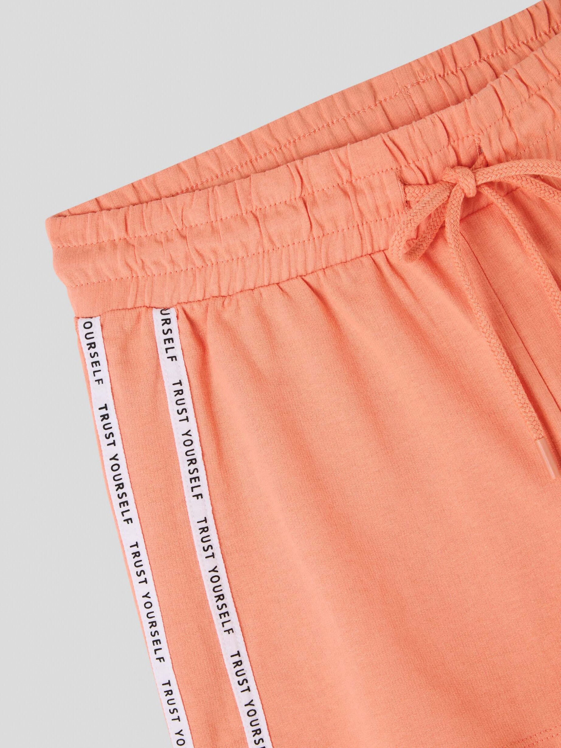 Salmon pink Tracksuit shorts with side stripes and lettering