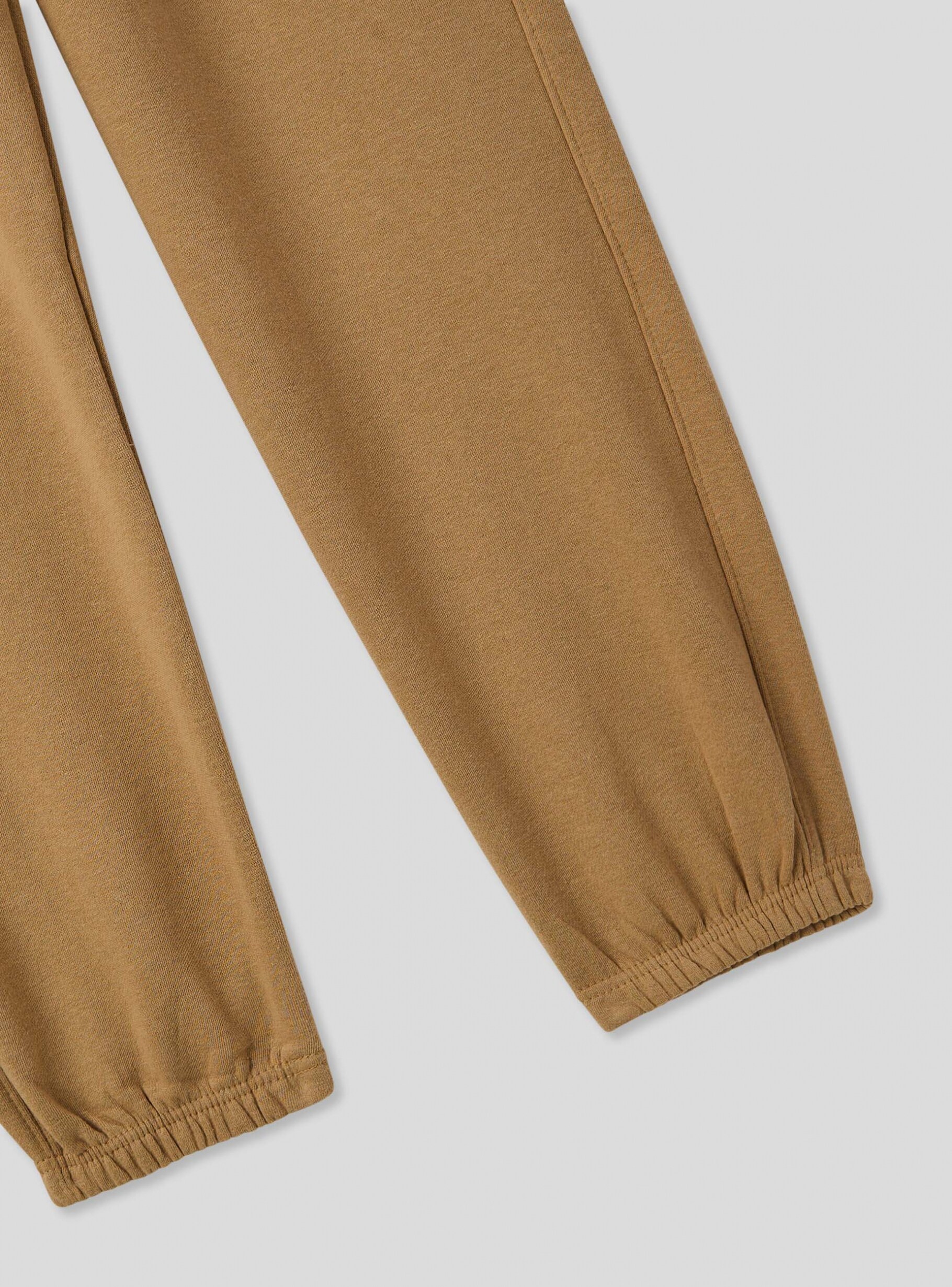 Beige light Gothic print tracksuit bottoms in heavy fabric