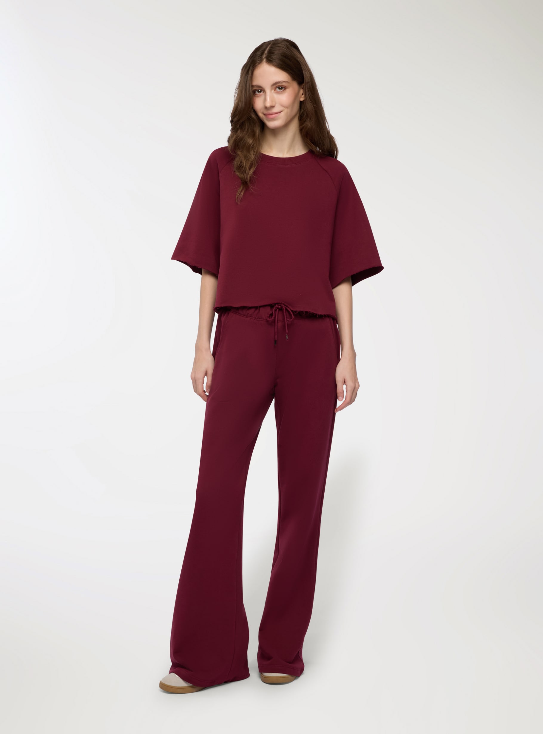 Pantaloni tuta a zampa vita bassa Bordeaux Acquista Online