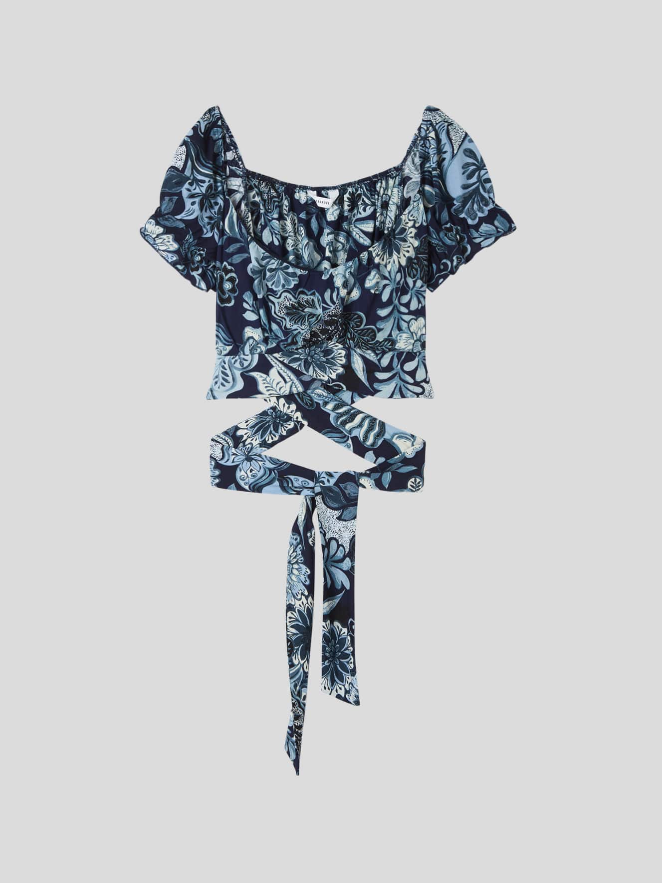 Blusa fantasia con fiocco