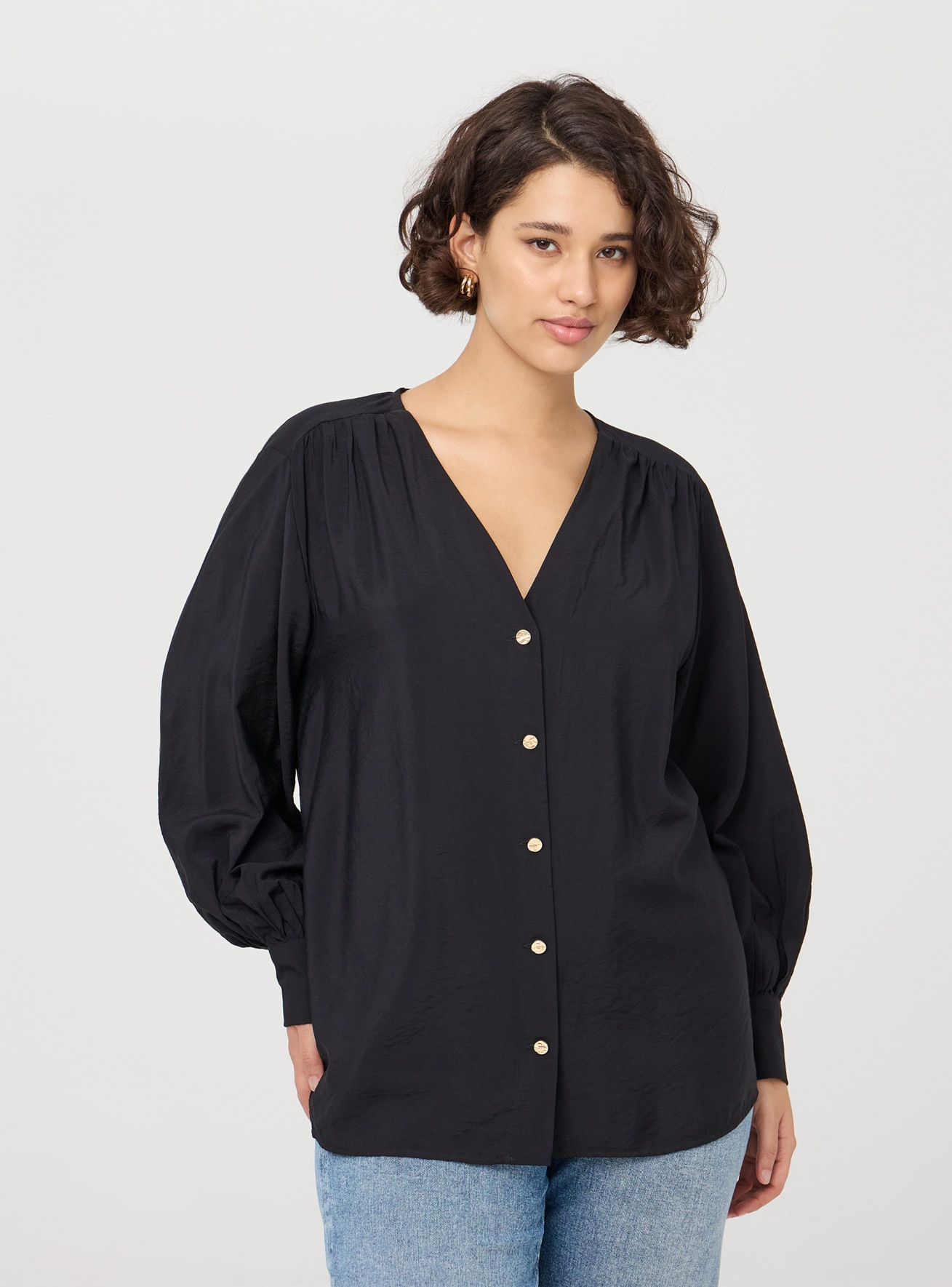 Blusa con scollo a v e bottoni