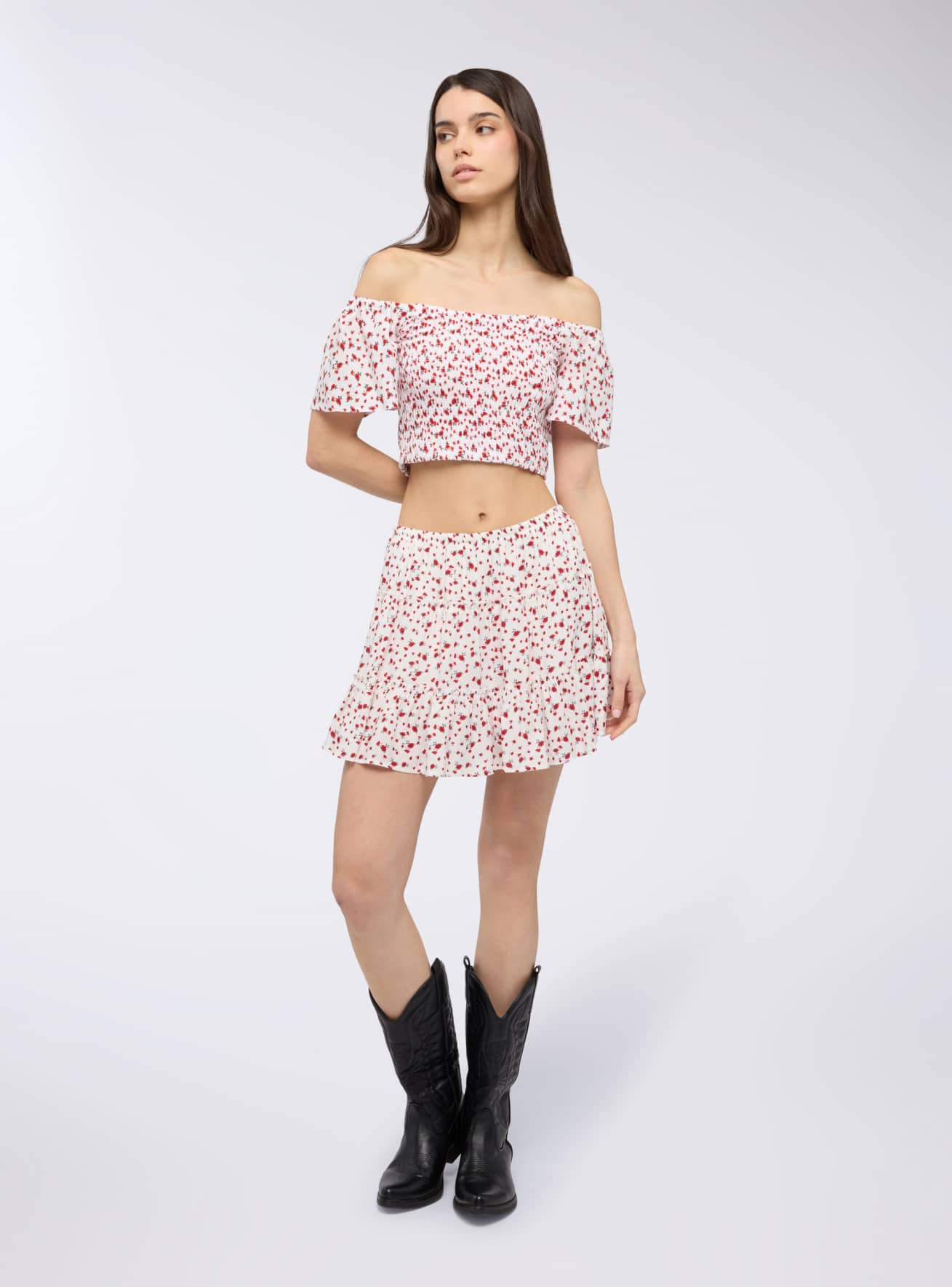 Blusa crop floreale in punto smock