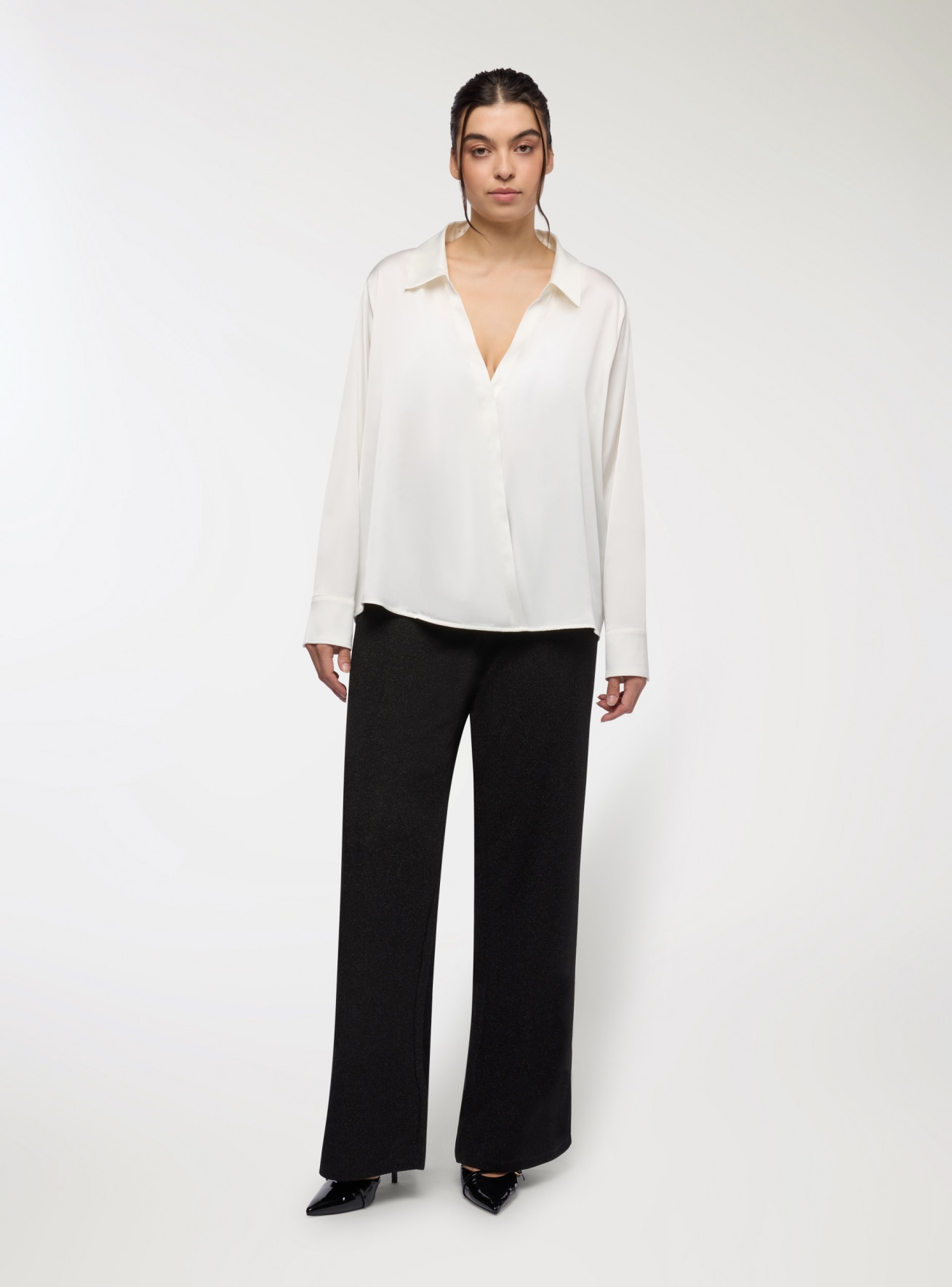 Pantaloni a zampa effetto luccicante