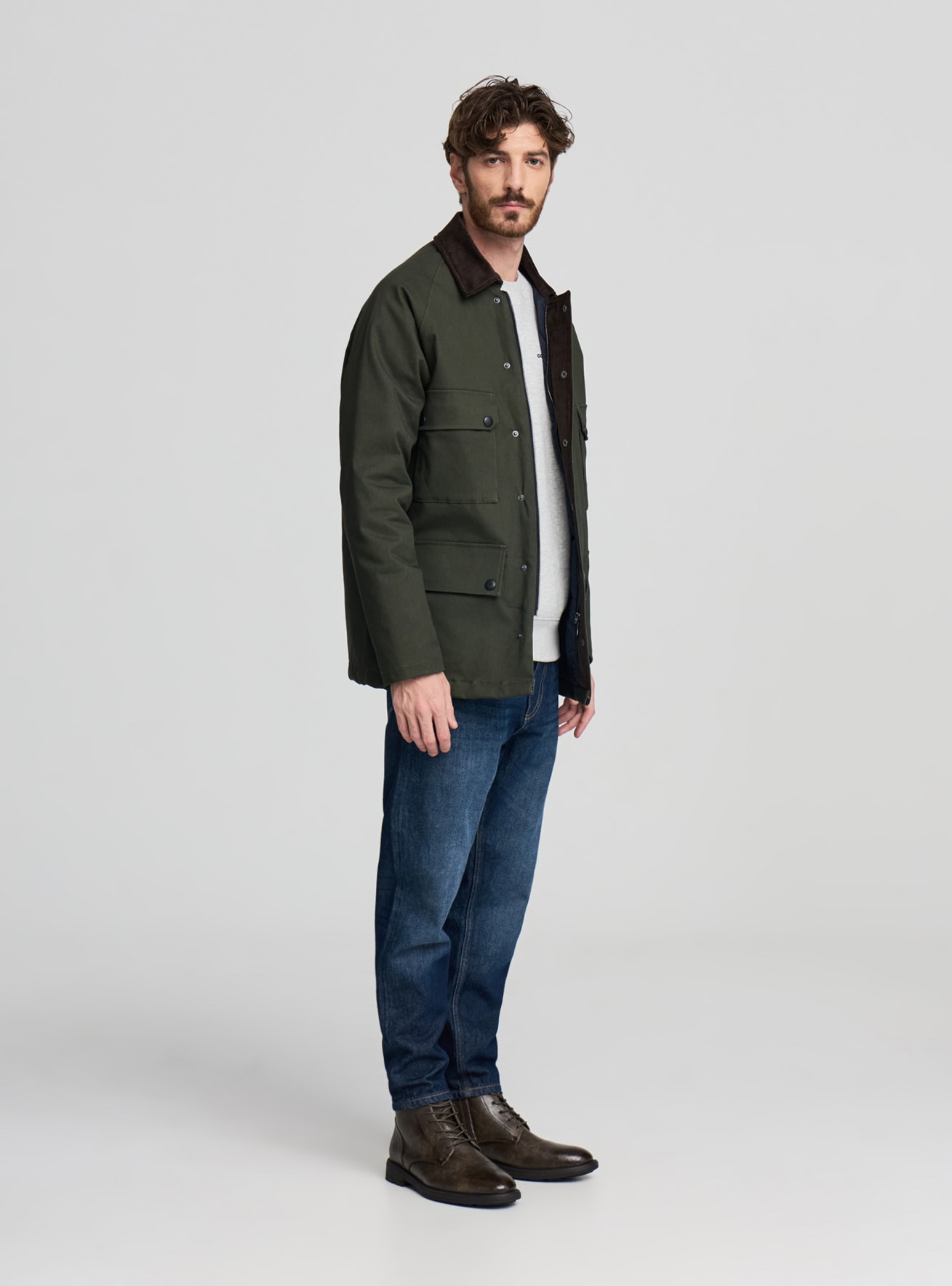 Giacca lunga con tasche a pattina