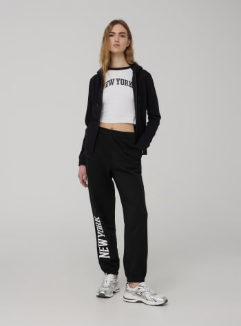 パンツ The Row Pantaloni Vita Alta Neri Realizzati In Lana Tinta Un Pantaloni della tuta a vita alta con polsini Nero - Acquista