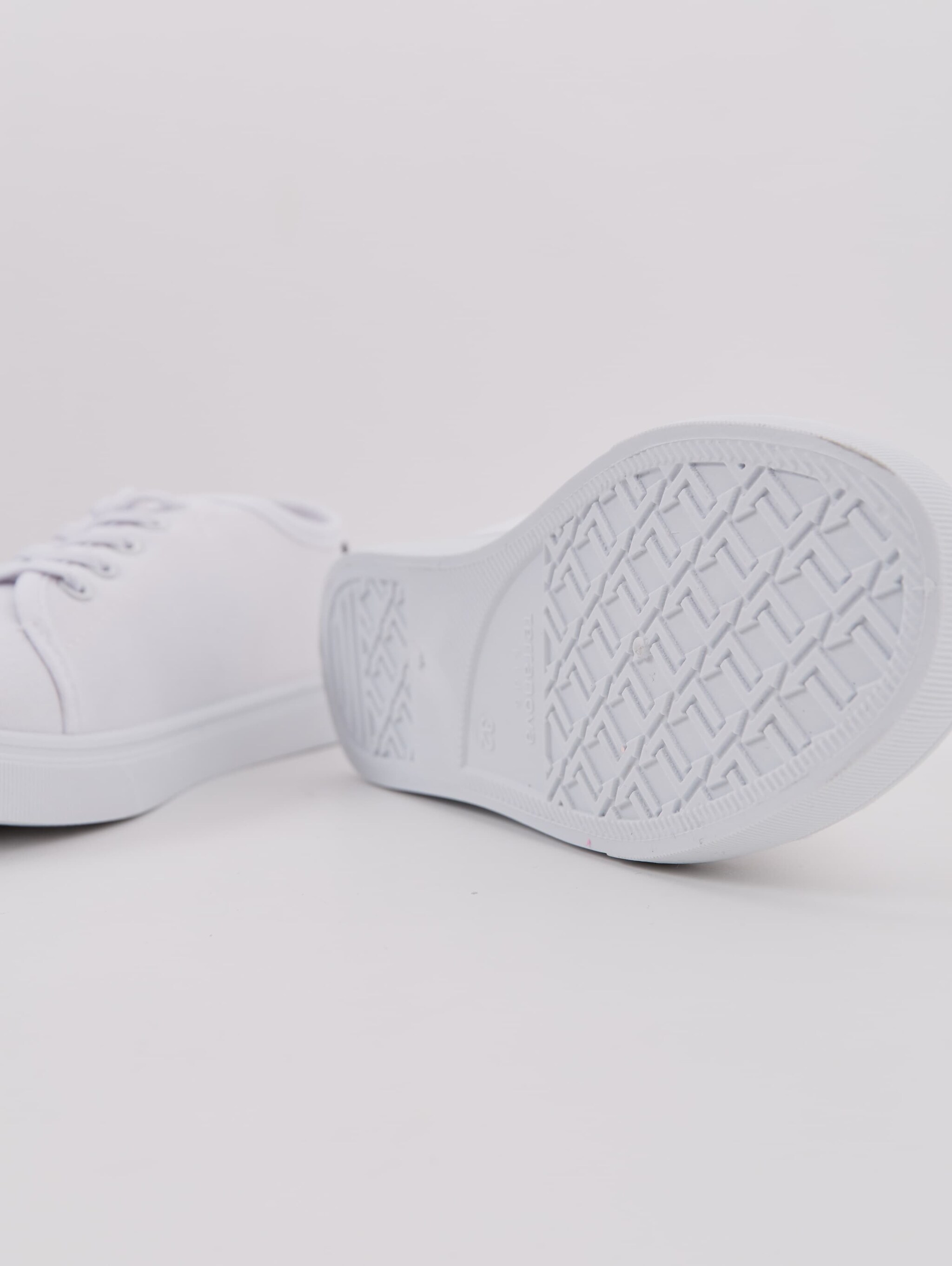 white canvas sports shoes